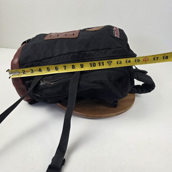 black backpack with leather bottom Amelia making it the ultimate choice for professionals and adventurers alike Vintage JanSport Leather Bottom Backpack